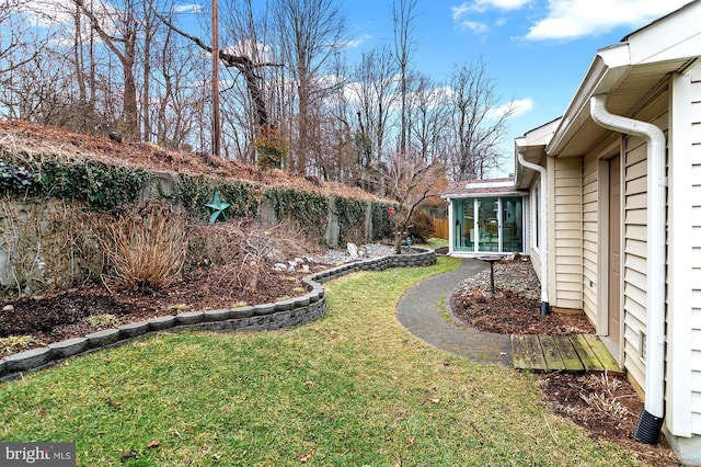 view of yard featuring a sunroom