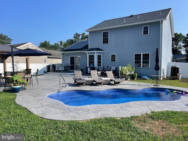 view of pool featuring a patio area and a hot tub