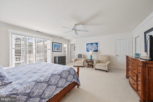 carpeted bedroom featuring ornamental molding and ceiling fan