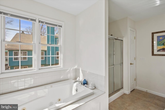 bathroom with shower with separate bathtub and tile patterned flooring