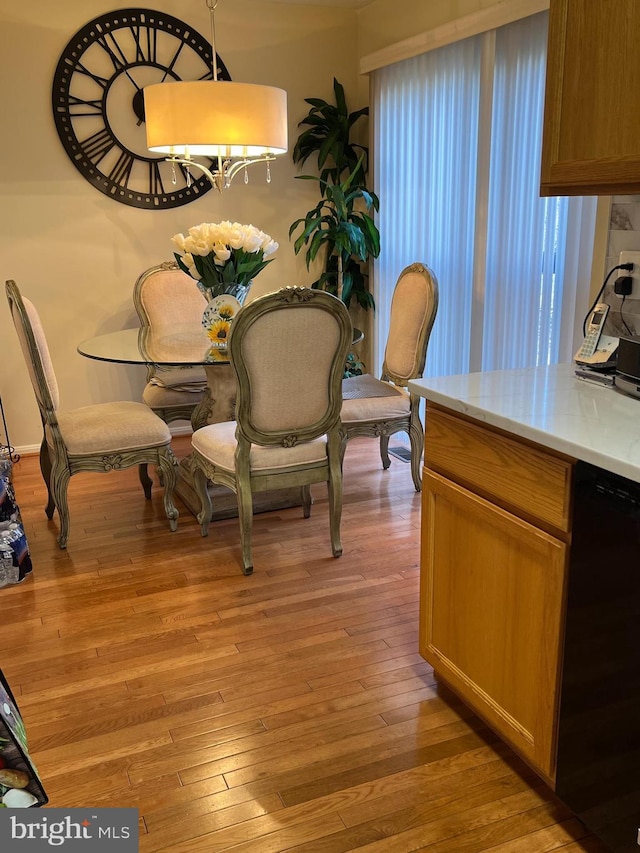 dining area with light hardwood / wood-style flooring