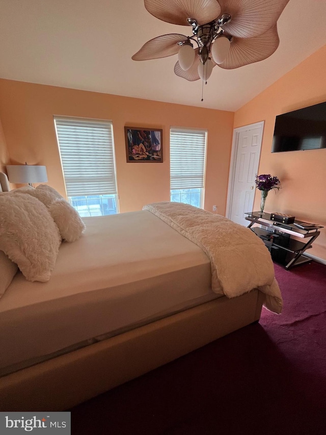 carpeted bedroom with lofted ceiling and ceiling fan