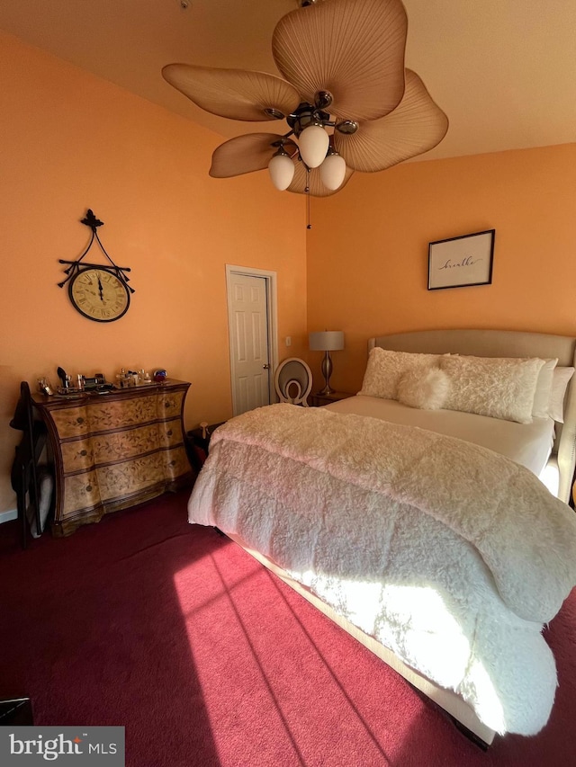 carpeted bedroom with ceiling fan