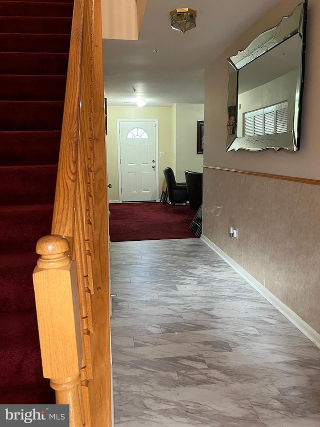 hallway with hardwood / wood-style flooring