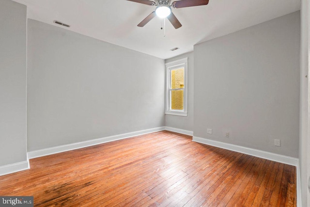 spare room featuring ceiling fan and light hardwood / wood-style flooring