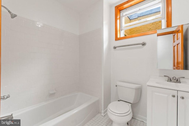 full bathroom with tiled shower / bath, vanity, toilet, and tile patterned flooring