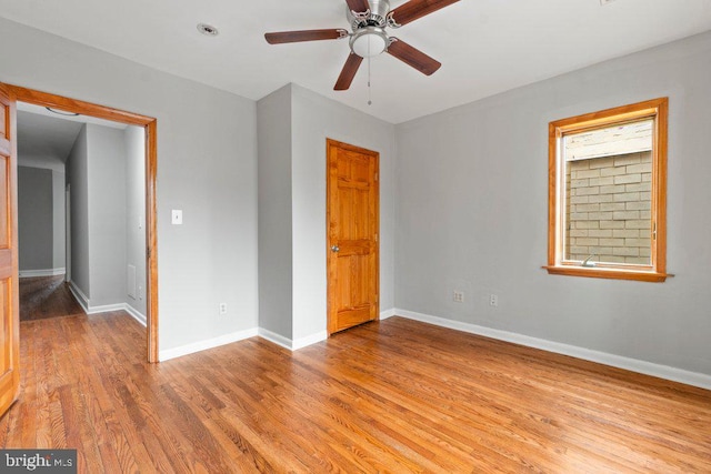 unfurnished bedroom with ceiling fan and light hardwood / wood-style flooring