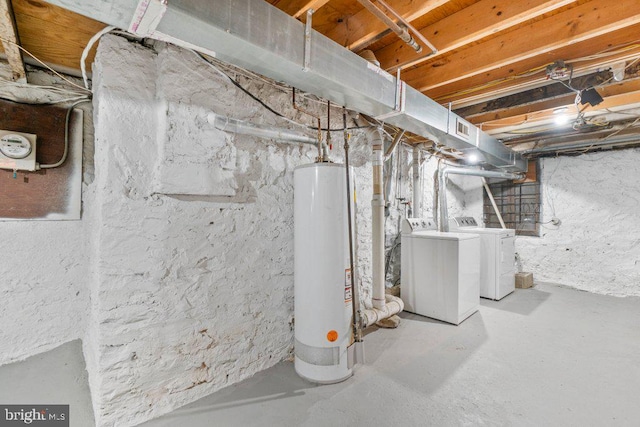 basement with independent washer and dryer and water heater