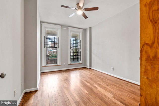 empty room featuring light hardwood / wood-style floors and ceiling fan