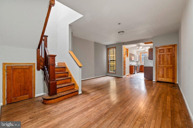 unfurnished living room with light wood-type flooring