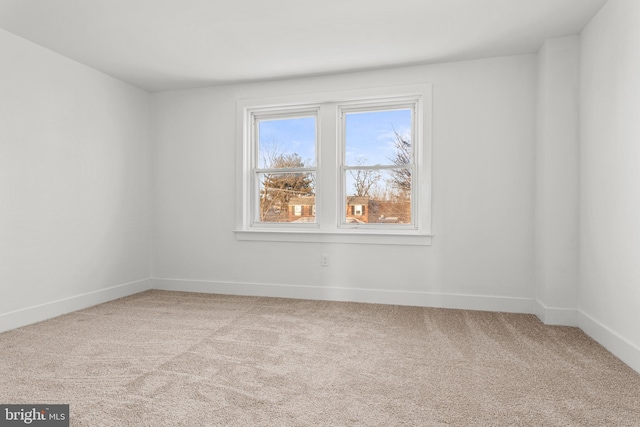 empty room featuring light colored carpet