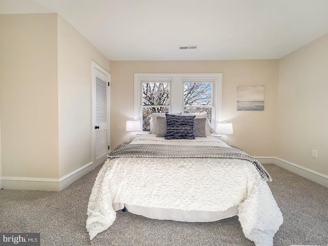 carpeted bedroom featuring a closet