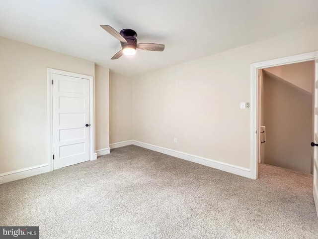 spare room with ceiling fan and carpet flooring