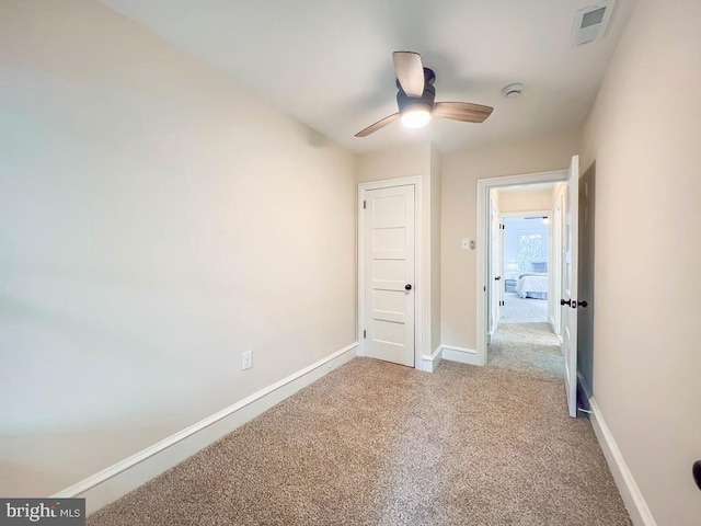 unfurnished bedroom featuring ceiling fan and carpet flooring