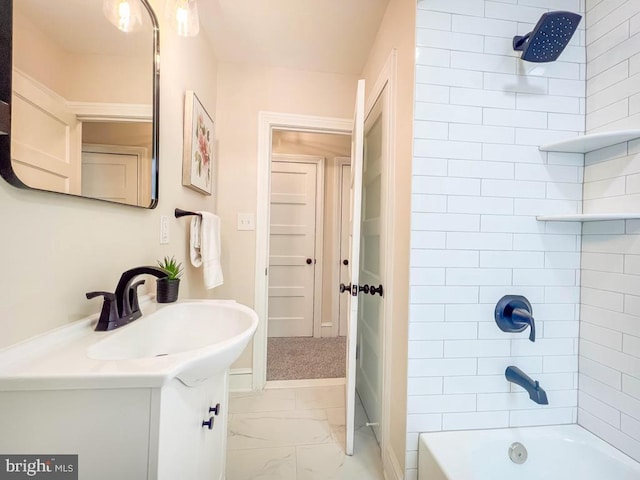 bathroom featuring vanity and tiled shower / bath combo