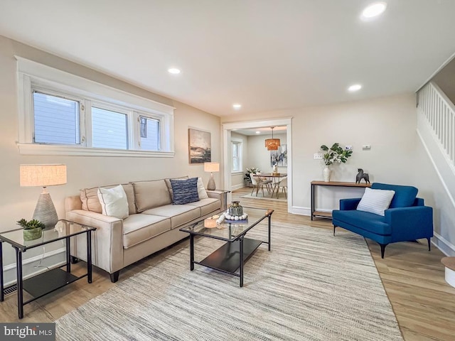 living room with light hardwood / wood-style flooring