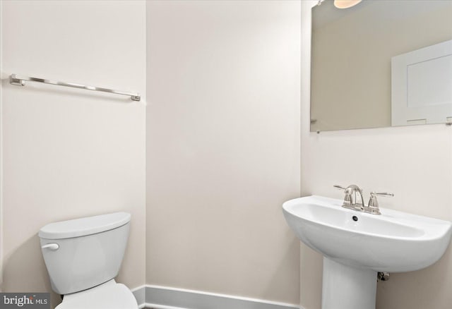 bathroom featuring sink and toilet