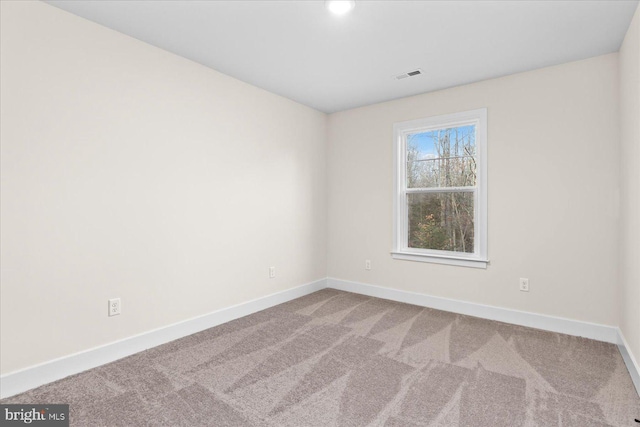 unfurnished room with carpet floors