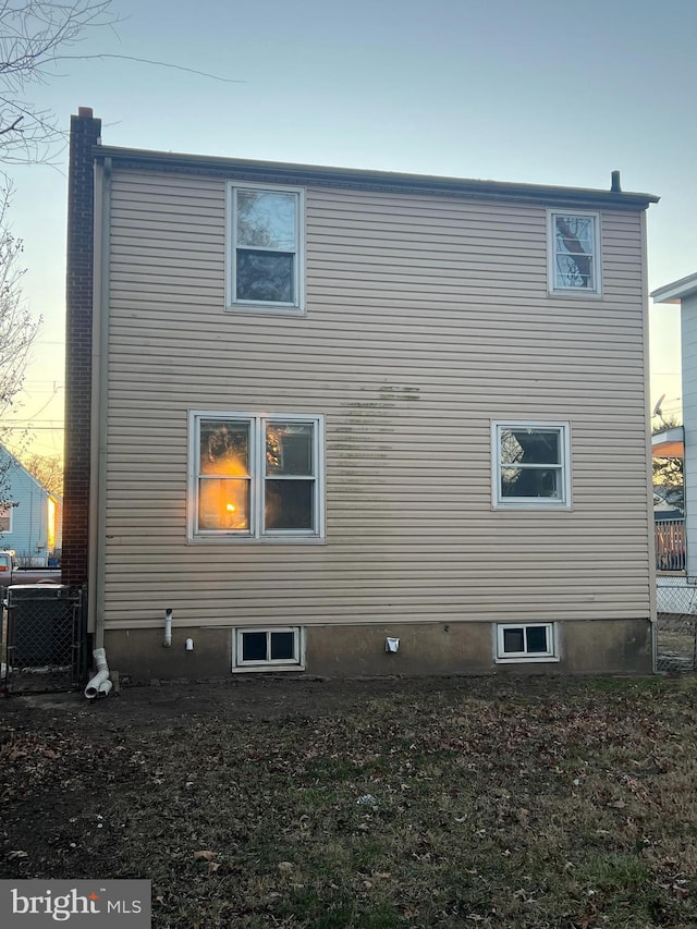 view of property exterior at dusk