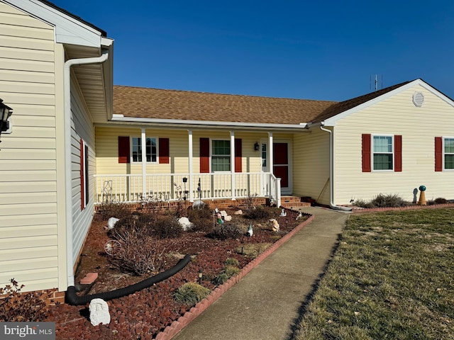 view of front of home featuring a porch and a front yard