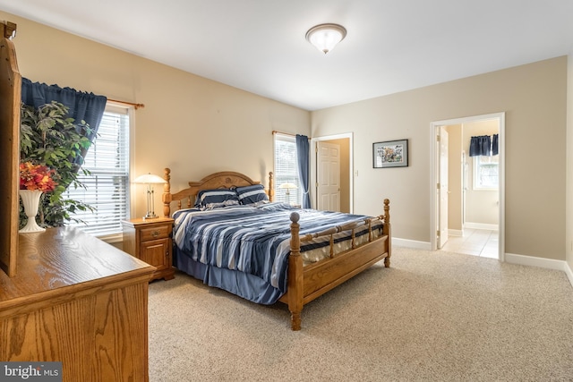 bedroom with light colored carpet