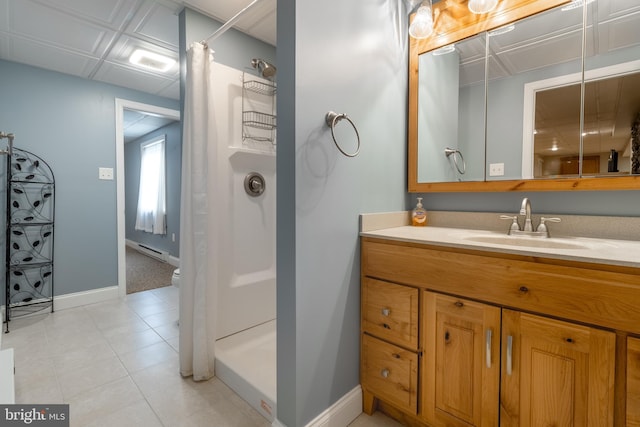 bathroom with tile patterned flooring, vanity, and curtained shower