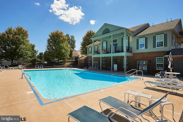 view of pool featuring a patio