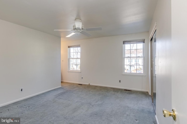 carpeted empty room with ceiling fan