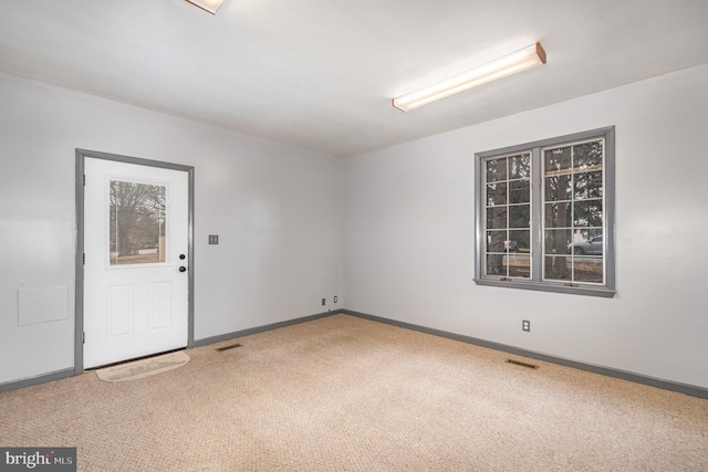 unfurnished room featuring carpet floors