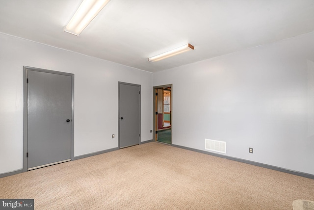 unfurnished room with carpet