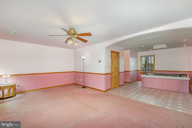 carpeted empty room with ceiling fan