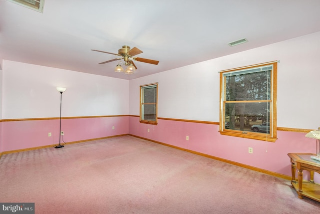 carpeted empty room with ceiling fan