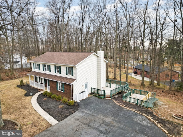 view of front of home with a porch and a deck