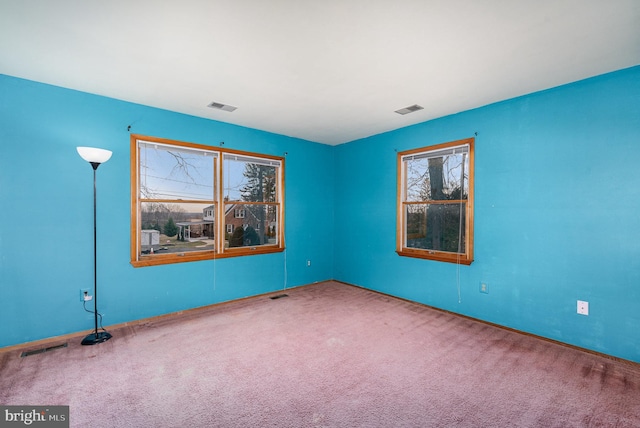 unfurnished room with carpet floors