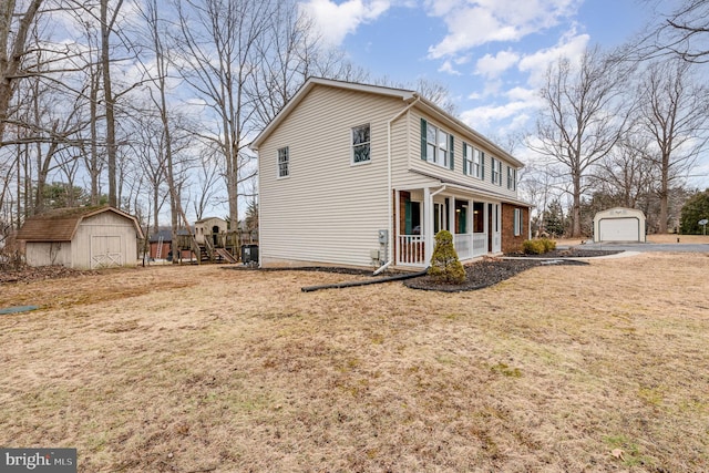 view of home's exterior featuring a lawn, a shed, a playground, covered porch, and a garage