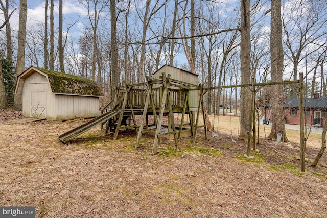 view of playground with a storage shed