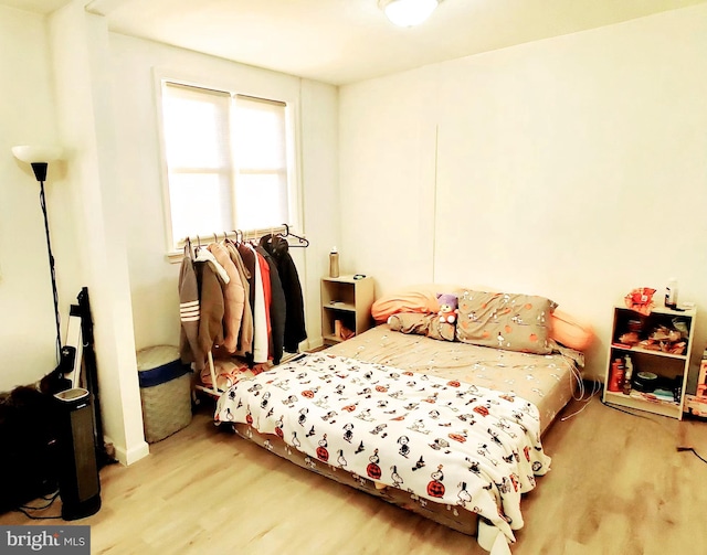 bedroom with light wood-type flooring