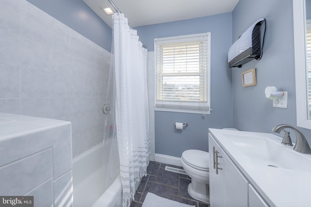 full bathroom with tile patterned floors, vanity, toilet, and shower / tub combo