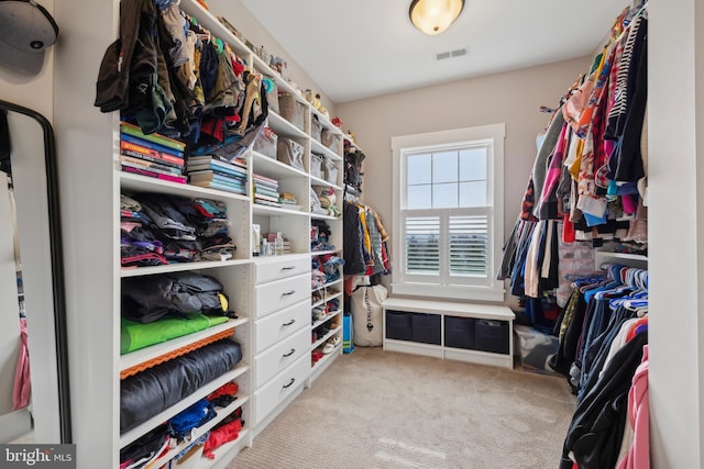 spacious closet with light carpet and visible vents