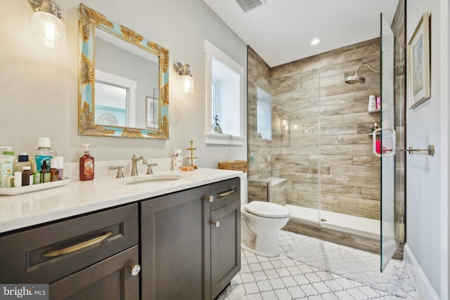 full bathroom with toilet, recessed lighting, vanity, baseboards, and a stall shower