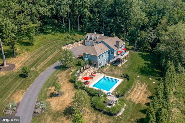 drone / aerial view featuring a view of trees