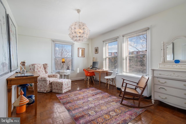 sitting room featuring dark parquet flooring