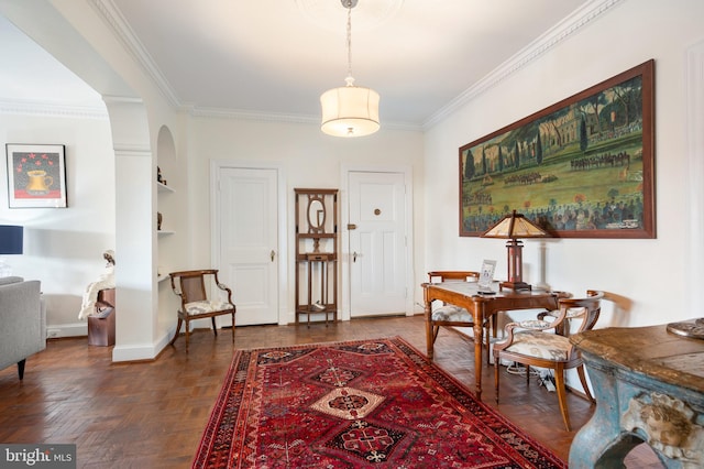 entryway with crown molding and dark parquet floors