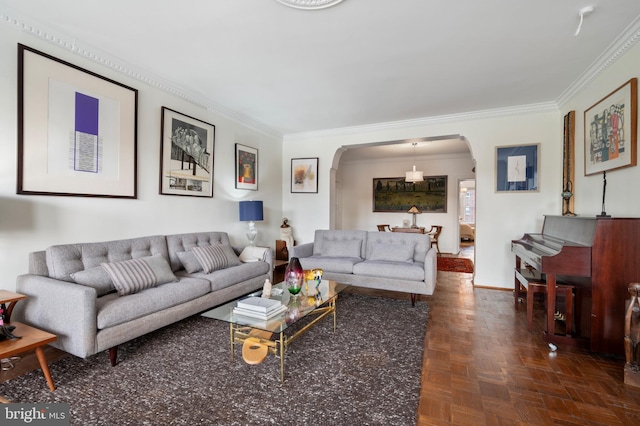 living room with crown molding and dark parquet floors