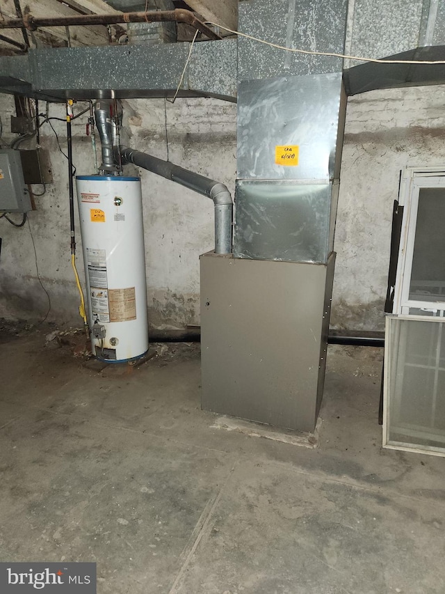 utility room with gas water heater