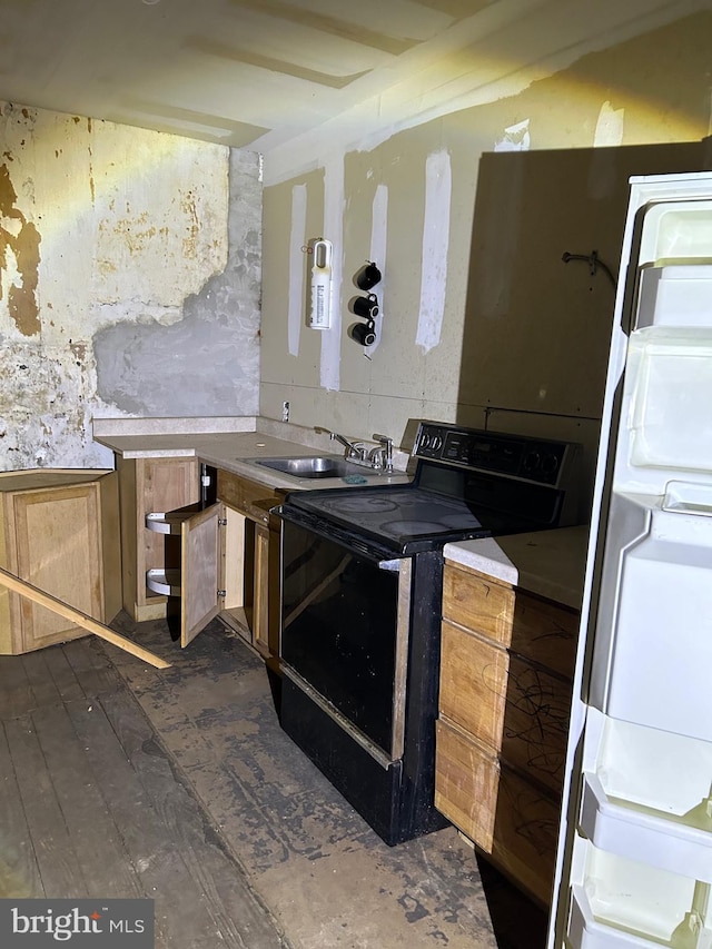 kitchen with black / electric stove, washer / dryer, and sink