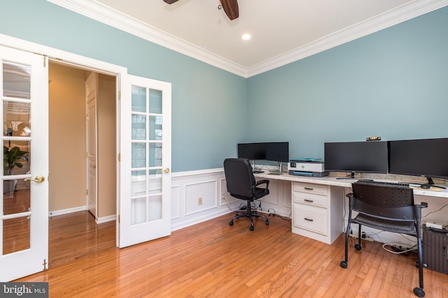 office space with light wood-type flooring, french doors, and ornamental molding