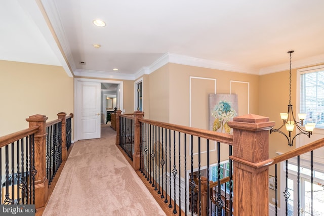 hall featuring an upstairs landing, recessed lighting, crown molding, light colored carpet, and a chandelier