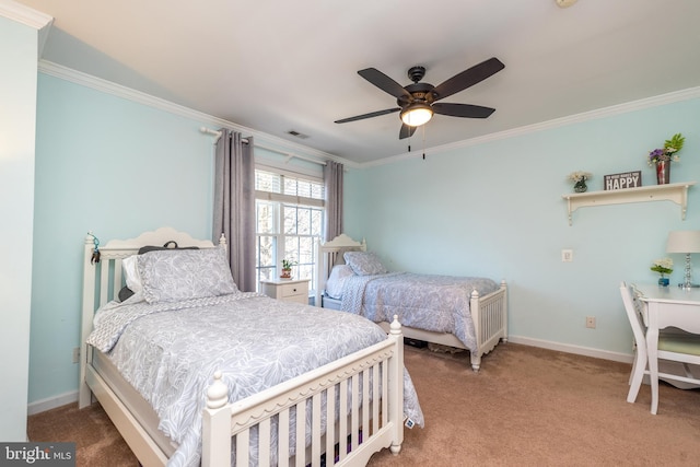 bedroom with baseboards, carpet floors, and crown molding