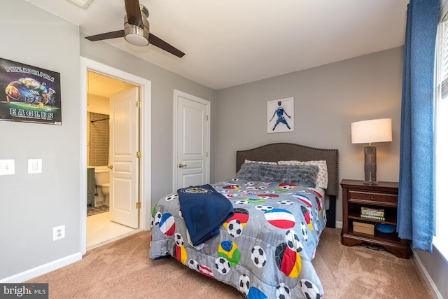 bedroom featuring ensuite bath, carpet flooring, a ceiling fan, and baseboards